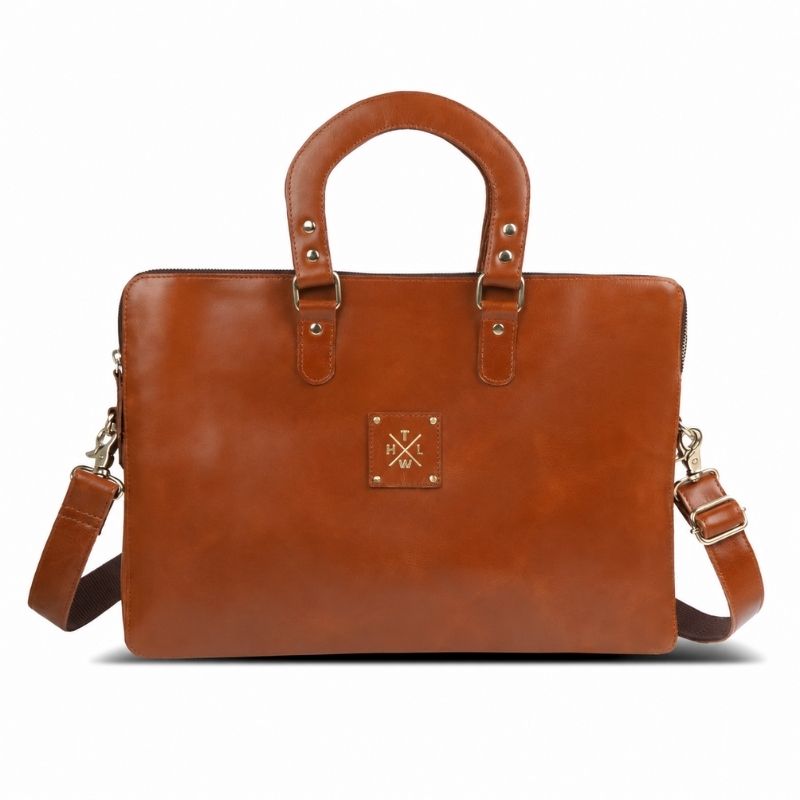 Brown leather laptop bag with a visible brand logo on a white background