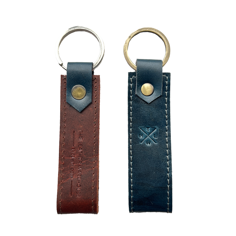 Two leather keychains with metal rings on a white background