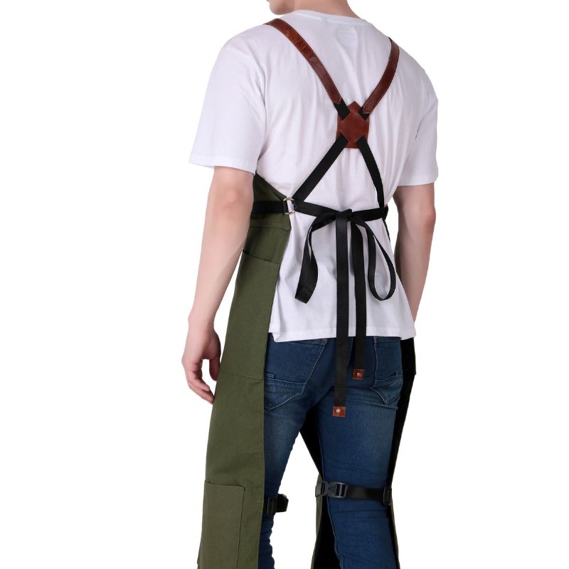 Person wearing a white shirt, green pants, and blue jeans with suspenders on a white background