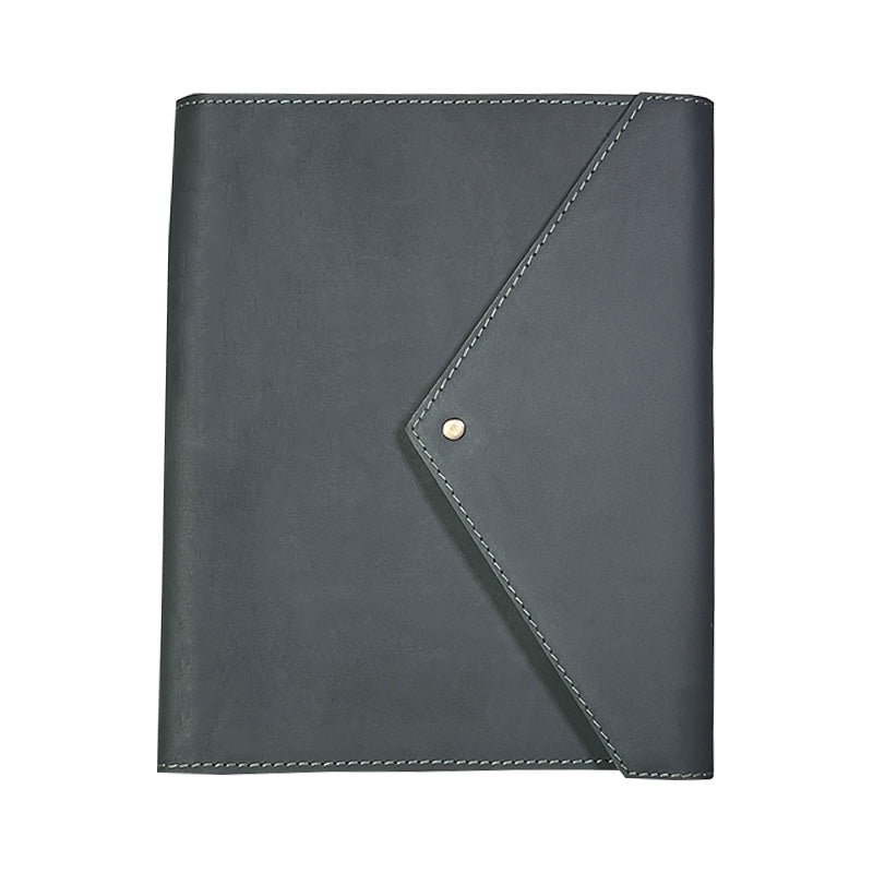 Dark gray leather notebook with a gold button on a white background