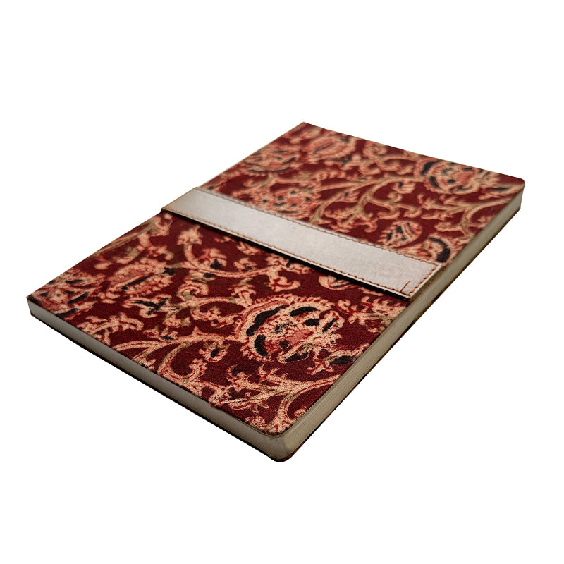 Notebook with a red and gold paisley pattern on a white background