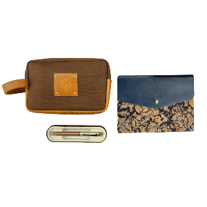 Brown toiletry bag, pen case, and blue floral pouch on a white background
