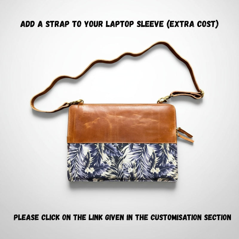 Brown leather and floral patterned laptop sleeve with an additional strap on a white background.