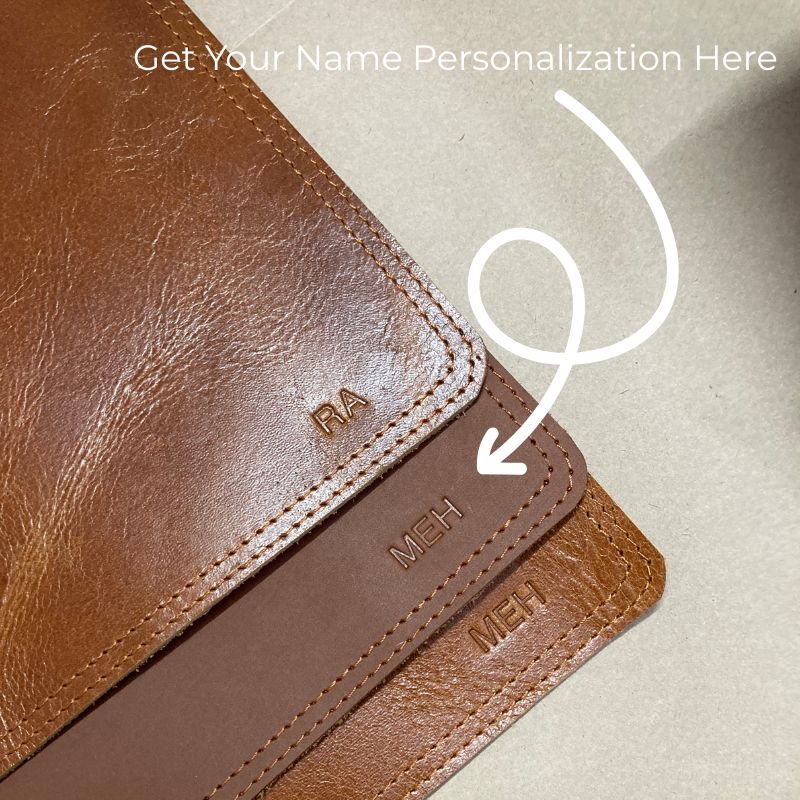Brown leather wallet with 'Meh' text and a call to action for personalization on a beige background.