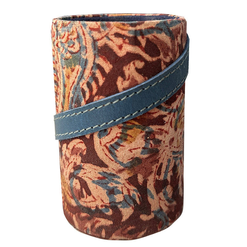 Fabric-wrapped cylindrical object with a blue strap on a white background