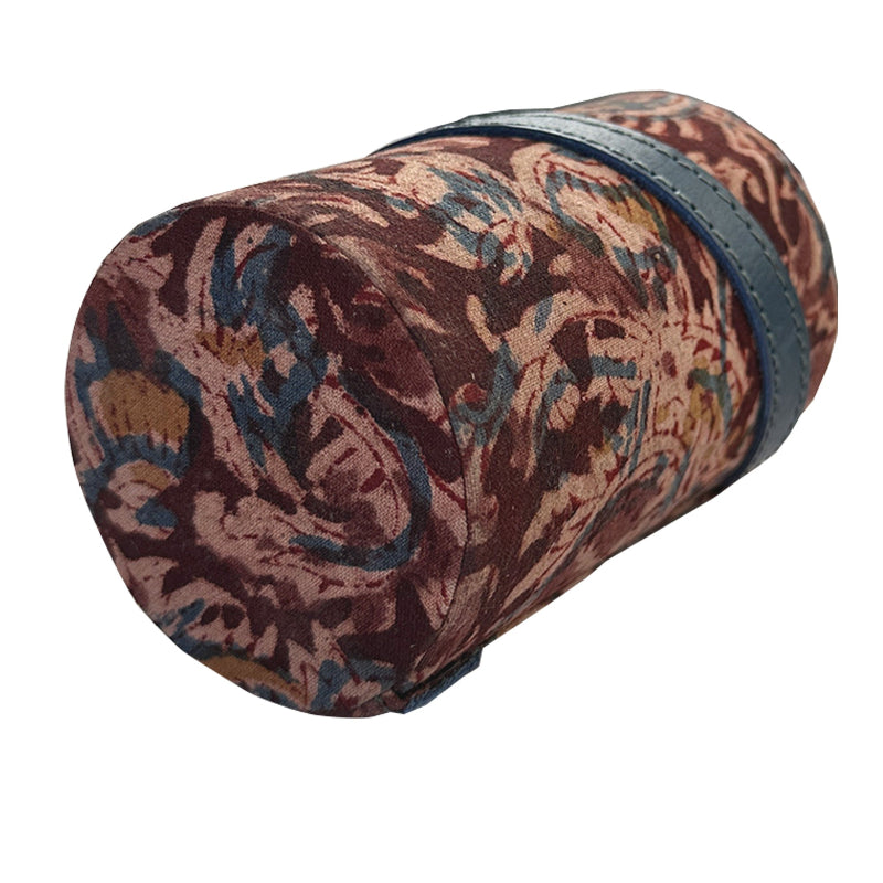 Decorative cylindrical pillow with intricate pattern on a white background