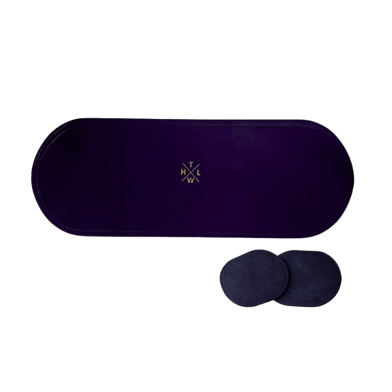 Navy blue eye placemat with two additional coaster on a white background
