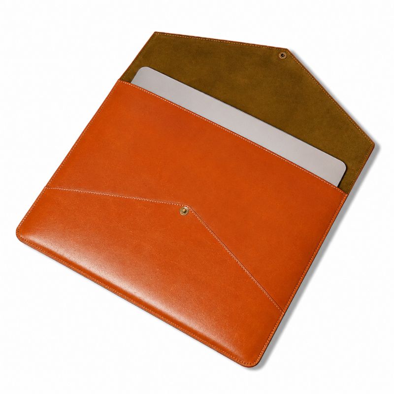 Orange leather sleeve with a brown interior on a white background
