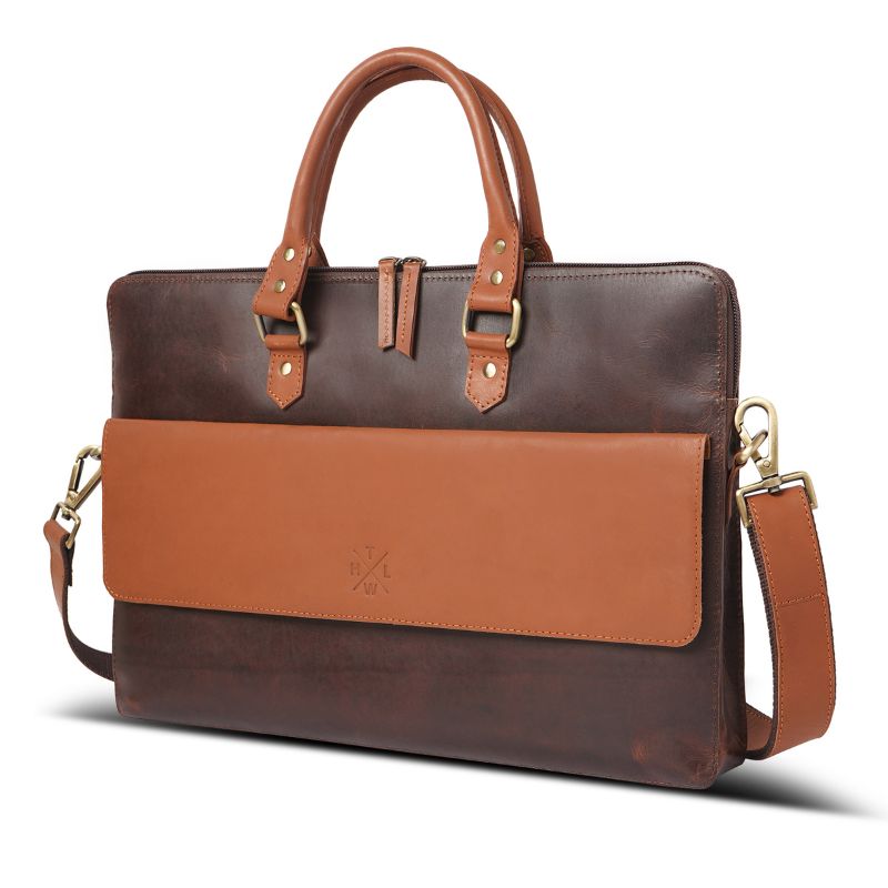 Brown leather laptop bag with a shoulder strap on a white background