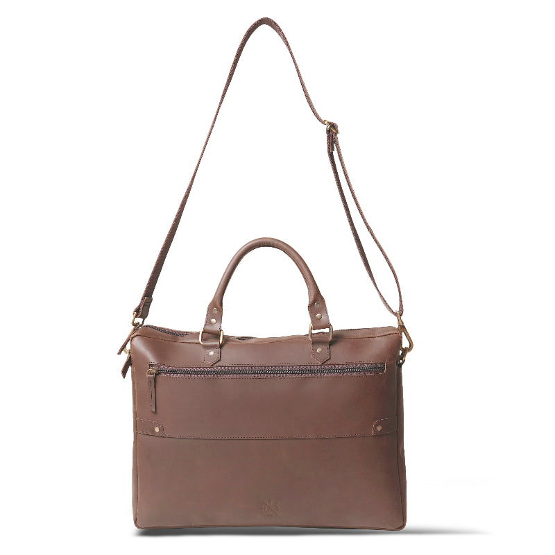 Brown leather handbag with a shoulder strap on a white background
