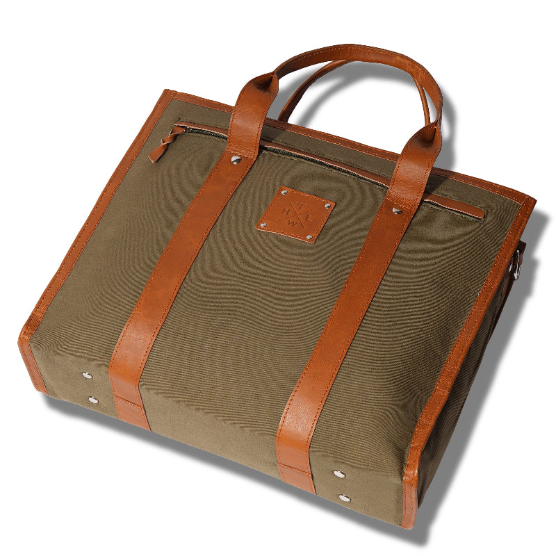 Brown leather-bound bag with a visible brand logo on a white background