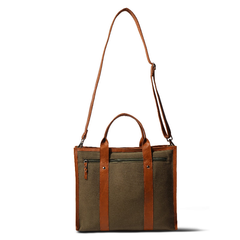Brown and beige tote bag with leather straps on a white background
