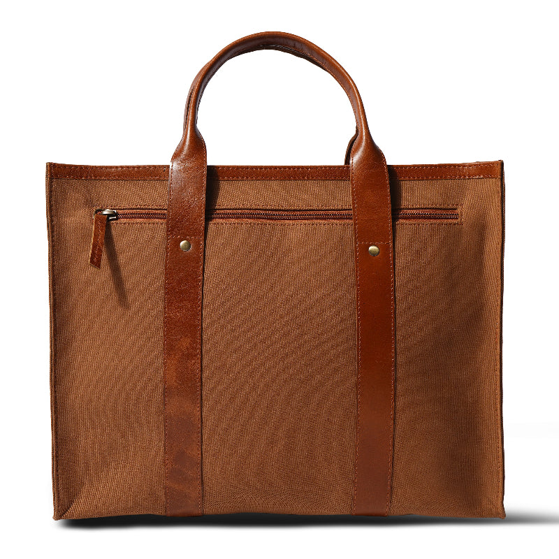 Brown leather tote bag on a white background