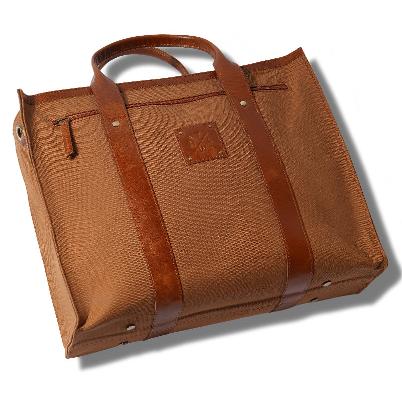 Brown leather bag with a visible brand logo on a white background