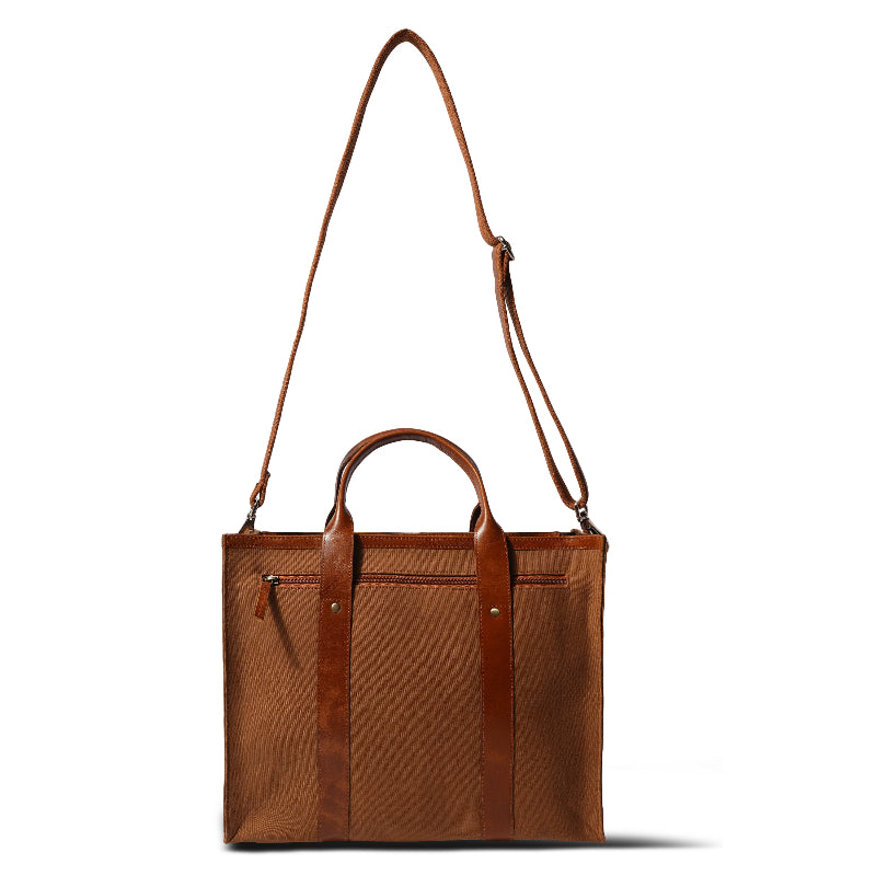 Brown tote bag with shoulder strap on a white background