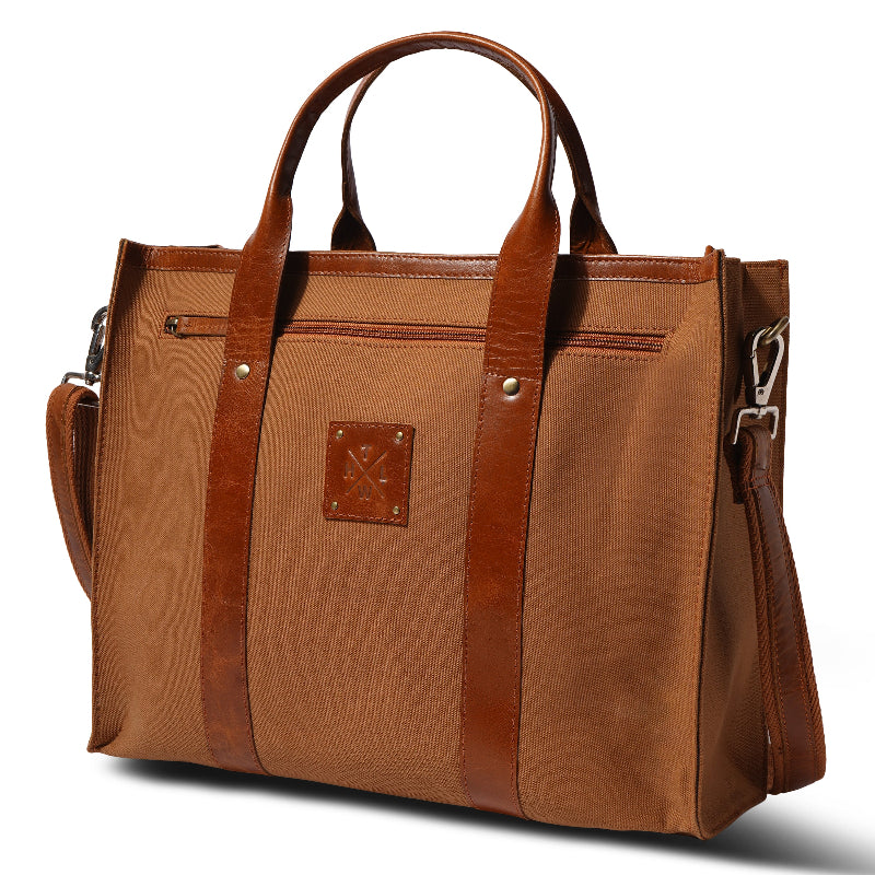 Brown leather handbag with a visible brand logo on a white background