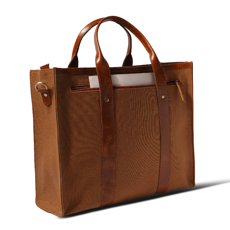 Brown leather tote bag on a white background