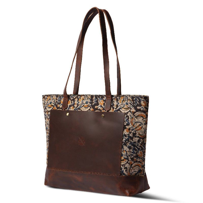 Brown tote bag with floral patterned sides on a white background