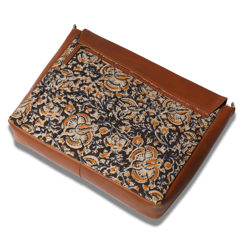 Floral-patterned fabric on a brown leather-bound cover
