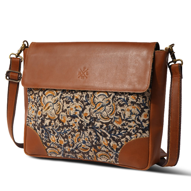 Brown leather and patterned fabric bag on a white background