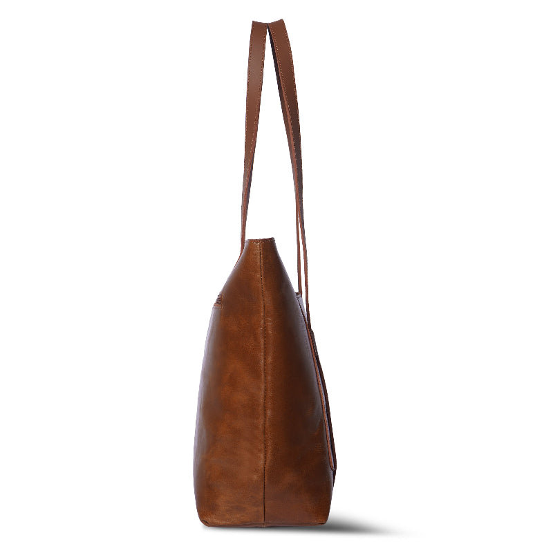 Brown leather tote bag on a white background