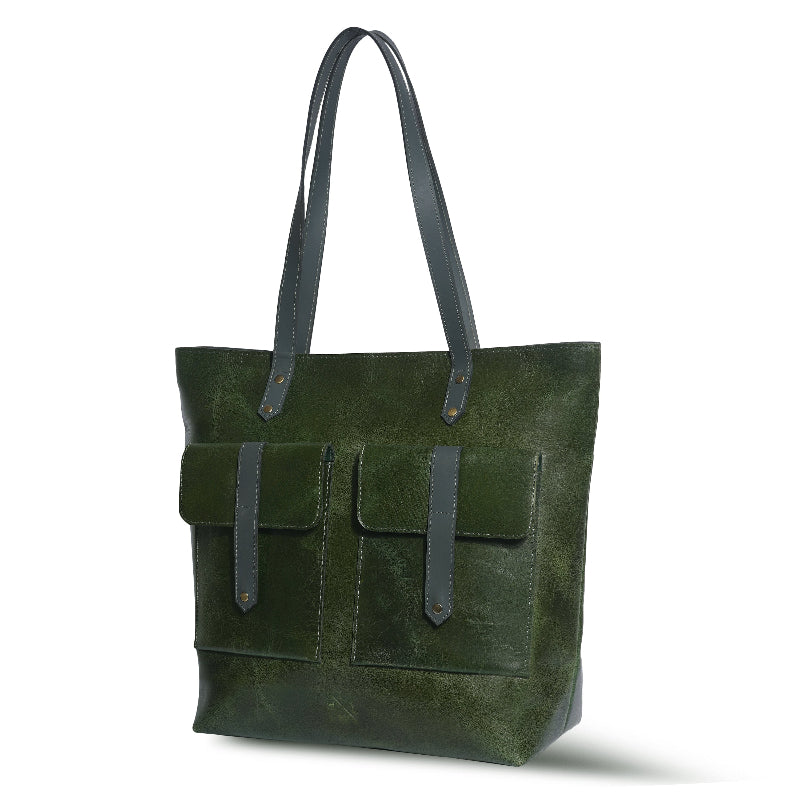Green leather tote bag with two front pockets on a white background