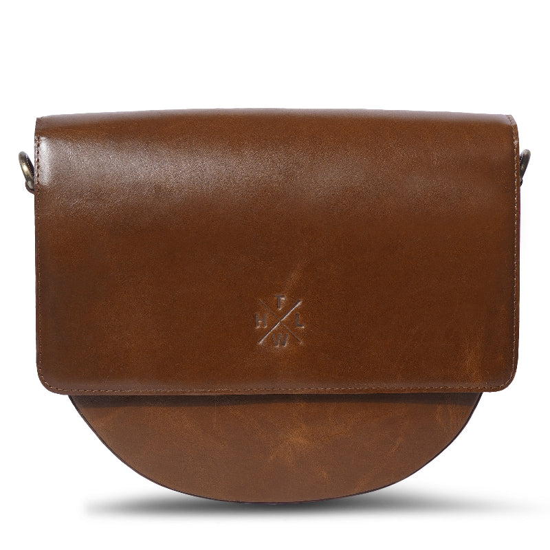 Brown leather handbag with a visible brand logo on a white background