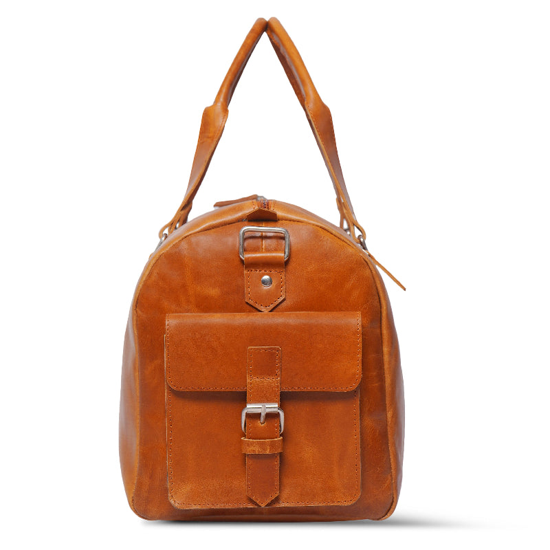 Brown leather bag with a buckle on a white background