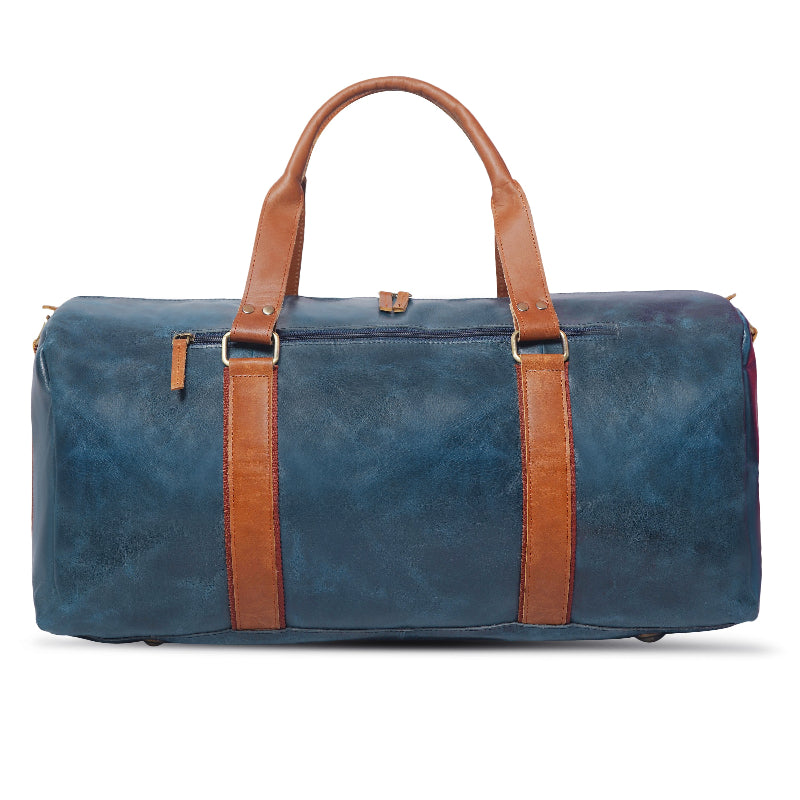 Blue duffel bag with brown straps on a white background