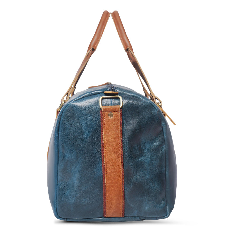 Blue leather bag with brown accents on a white background