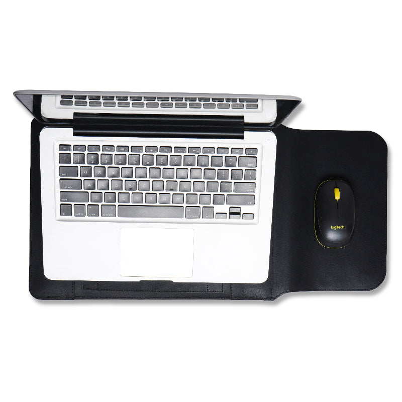 Laptop on a black desk/sleeve with a mouse to the right on a white background