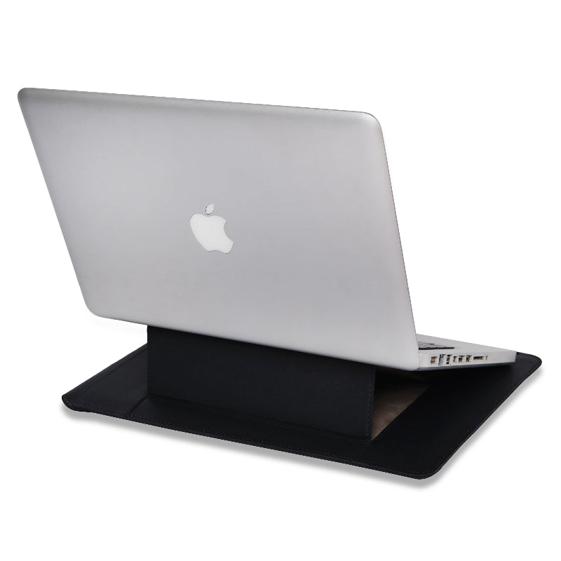 Silver laptop with Apple logo on a black stand sleeve a white background