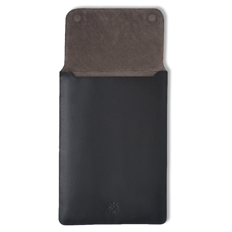Black leather sleeve with gray interior on a white background