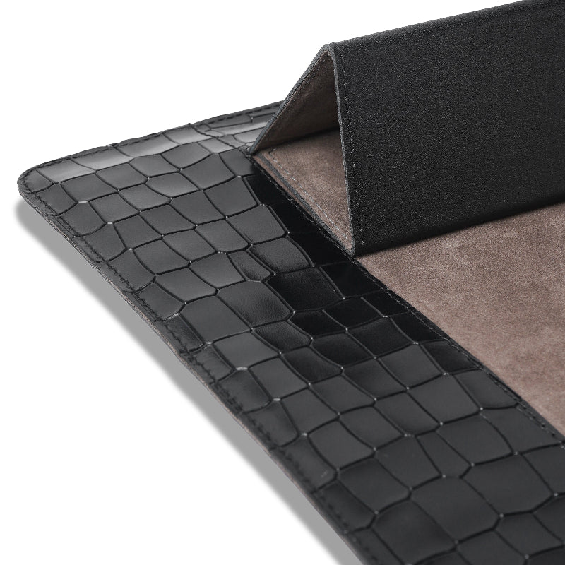 Black crocodile-patterned leather sleeve on a white background