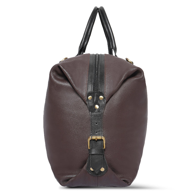 Brown leather bag with black straps on a white background