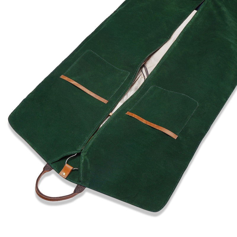 Green fabric with brown leather suit cover on a white background
