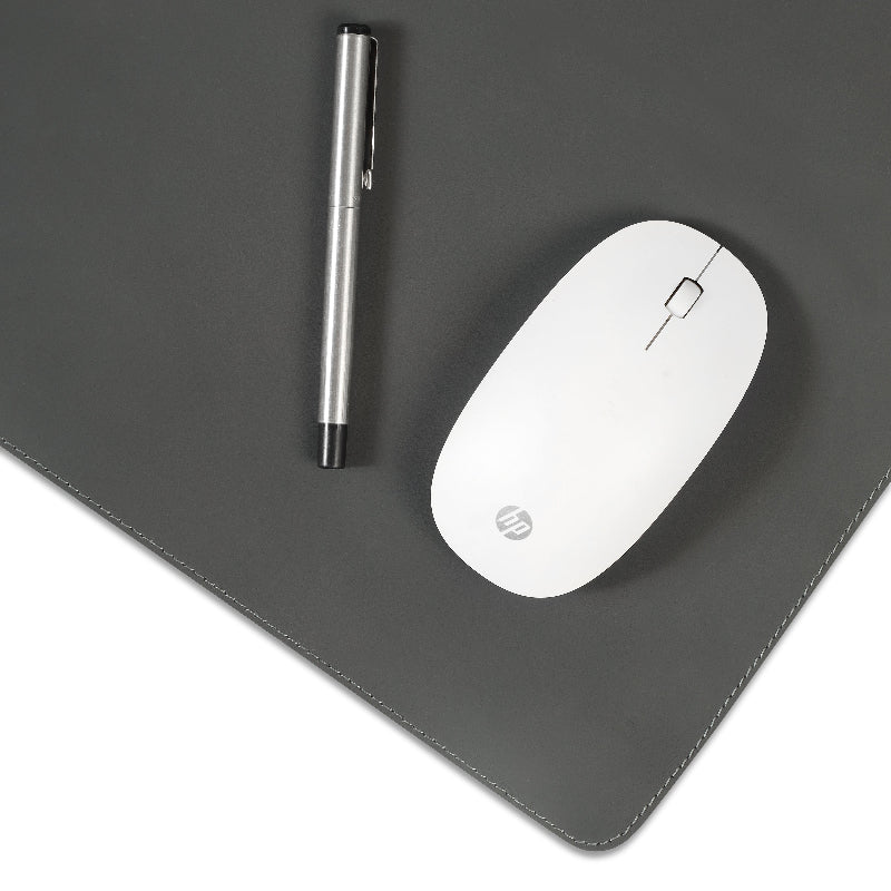White mouse and pen on a dark gray mouse pad