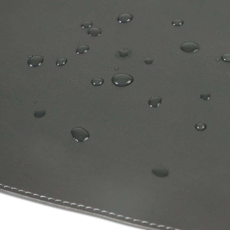 Gray leather desk mat with water droplets