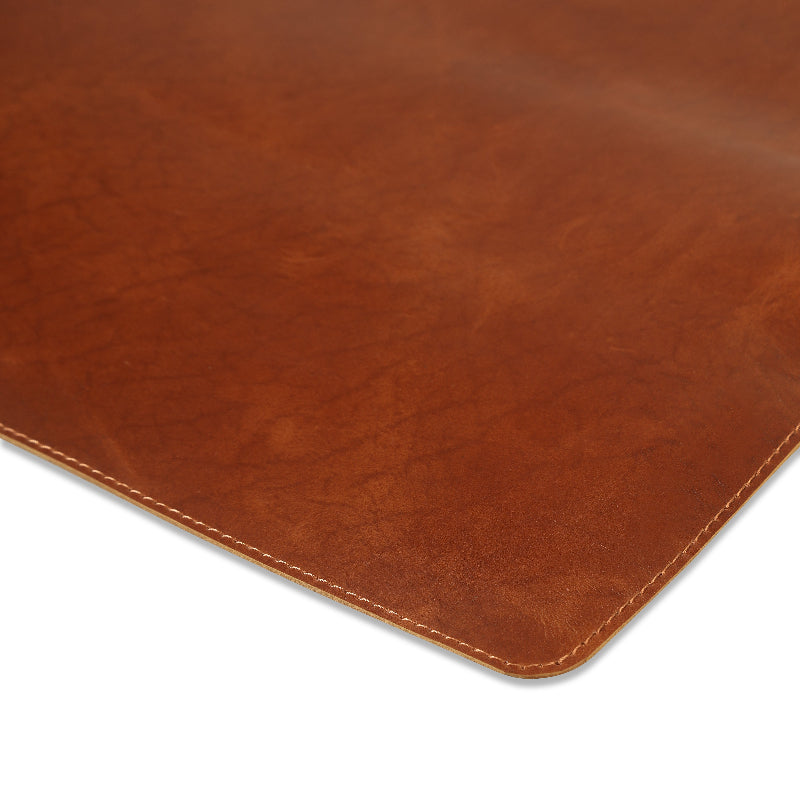 Brown leather mat on a white background