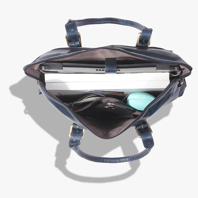 Navy blue leather bag with interior compartments on a white background