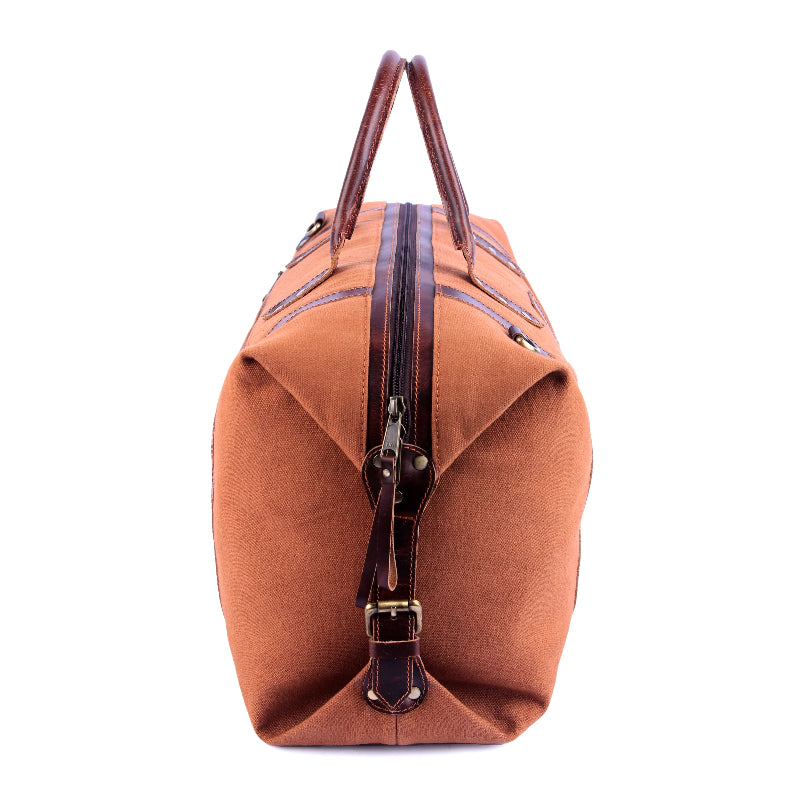Brown leather duffel bag with handles on a white background