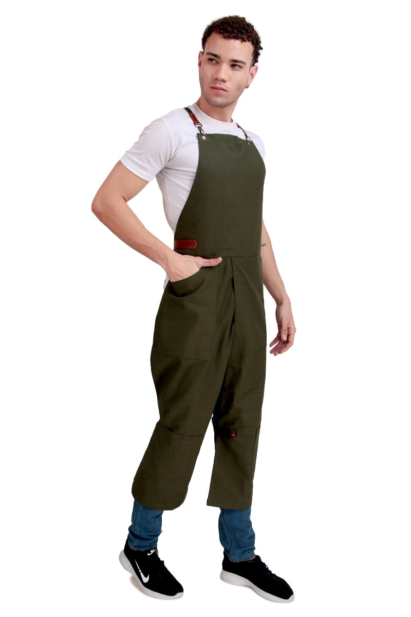 Man wearing green bib overalls on a white background