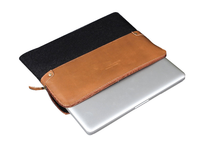 Black and brown laptop sleeve with a silver laptop on a white background