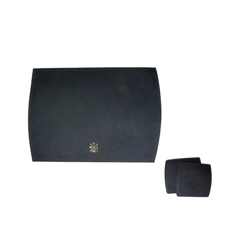 Black placemat with a logo and matching coasters on a white background