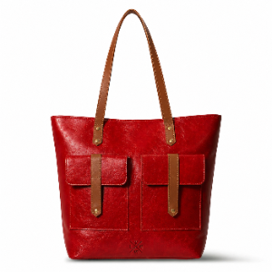 Red leather tote bag with brown straps and accents on a white background