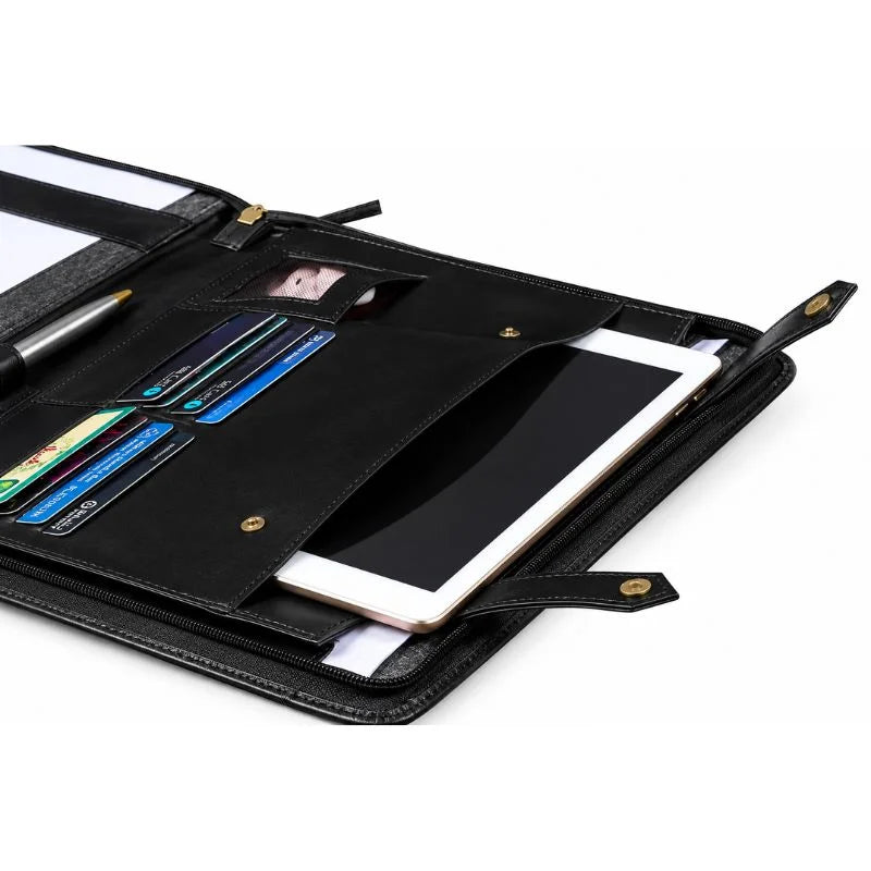 Open black leather zippered portfolio with a notepad held by elastic straps on the right, and card slots