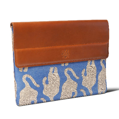 laptop sleeve with brown leather flap and blue fabric with tiger pattern