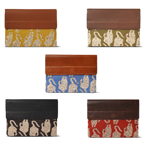 Set of five patterned laptop sleeve with brown leather accents on a white background