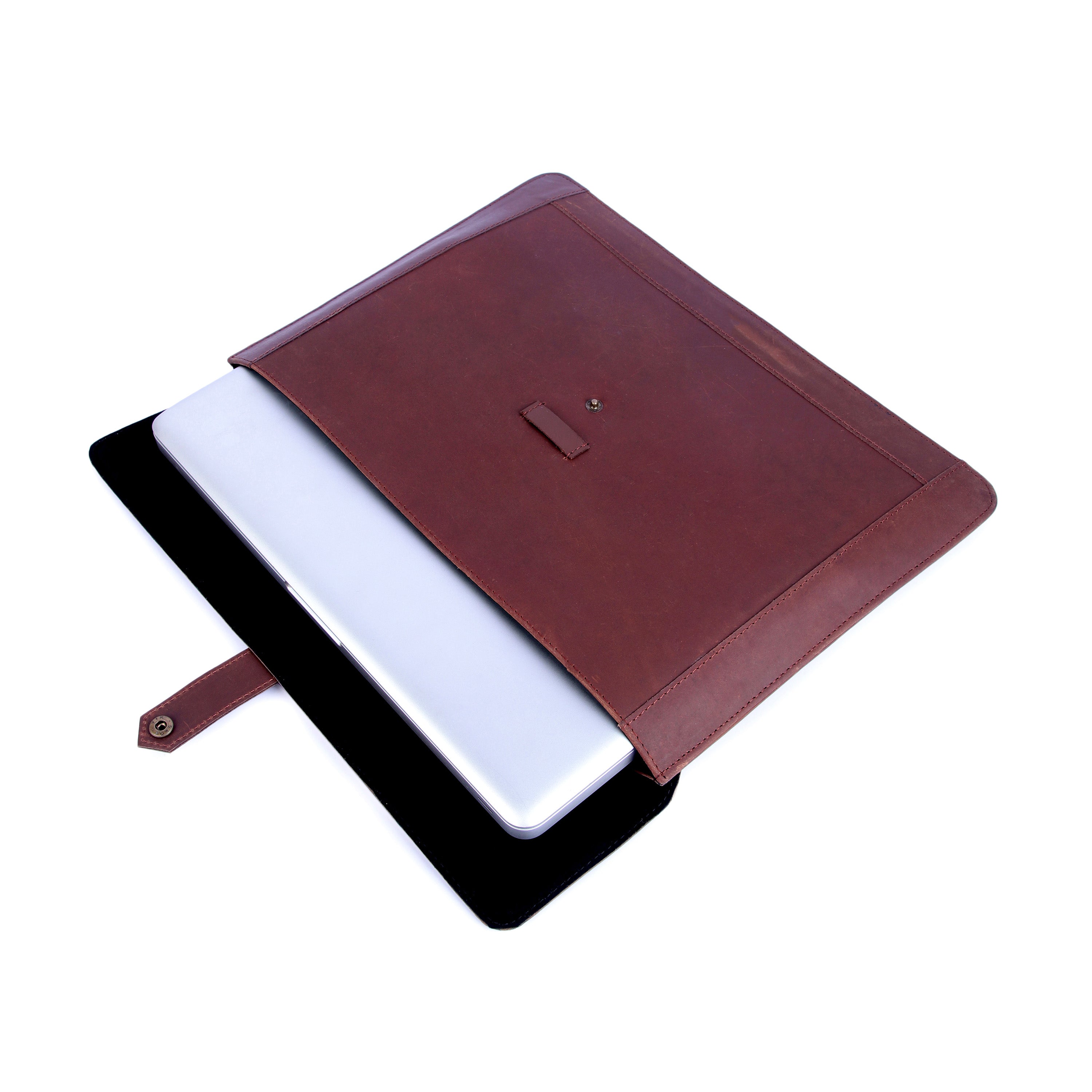 Brown leather notebook cover with a white interior on a white background