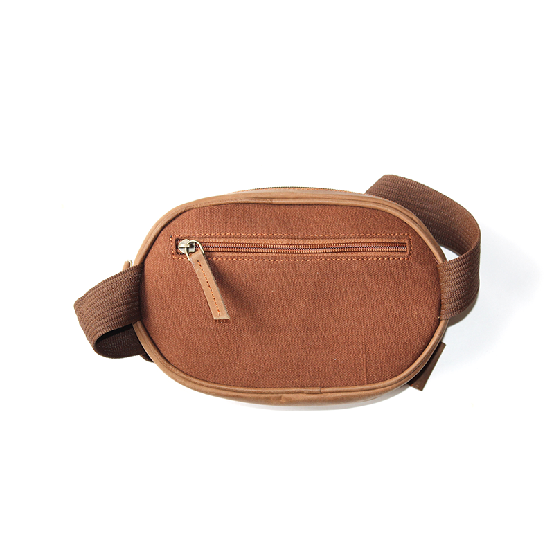 Brown waist bag with a gold zipper on a white background